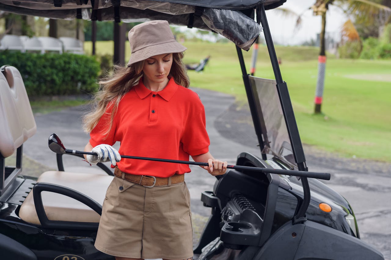 Woman Holding A Golf Club 9366571